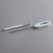 A white Comark digital pocket probe thermometer.