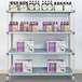 A MetroMax Q shelf with boxes and bottles on it.