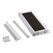 A white rectangular evaporator coil with black grids on a metal plate.