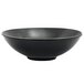 A Front of the House semi-matte black porcelain wide bowl with a spiral ink design.