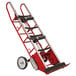 A red and silver Wesco Heavy-Duty Appliance Hand Truck with wheels and a handle.