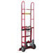 A red Wesco Industrial Products steel hand truck with wheels and a handle.