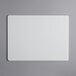 A white rectangular Tomlinson Chef's Edge cutting board.