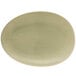 A white Front of the House Tides porcelain oval plate with a light green rim.