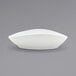 A Front of the House Tides white porcelain bowl with a curved edge on a white background.