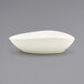 a white bowl on a gray surface