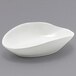 A white Front of the House Tides oval ramekin on a gray surface.