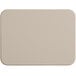 A beige rectangular Tomlinson Chef's Edge cutting board with rounded corners on a white surface.