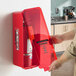 A red surface-mounted fire extinguisher cabinet with a red pull-cover, designed to hold a 10 lb. fire extinguisher.