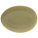 A close-up of a Front of the House Tides sea grass oval porcelain bowl with a brown rim.