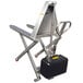 A silver stainless steel Wesco Industrial Products telescoping high lift pallet truck with a black container on it.
