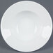 A white porcelain mixing bowl with a white rim.