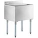 A Regency stainless steel underbar ice bin with sliding lid and bottle holders on a counter.