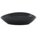 A black Front of the House Tides oval bowl with a curved edge on a white background.