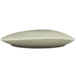 A white Front of the House Tides oval porcelain platter with a curved edge.