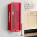 A red Cato surface-mounted fire extinguisher cabinet holding a fire extinguisher.