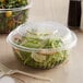 Two Dart C32BCD PresentaBowls filled with salad on a table.