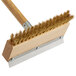 A Carlisle Sparta oven and grill brush with a wooden handle and metal scraper.