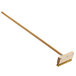A Carlisle Sparta oven and grill brush with a wooden handle.