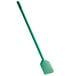 A green spade with a long handle.