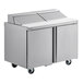 A stainless steel Delfield refrigerated sandwich prep table with two doors.