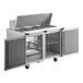 A stainless steel Delfield sandwich prep table with two doors.