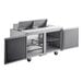 A Delfield stainless steel food prep table with two doors.