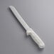 A Dexter-Russell white bread knife with a white handle.
