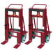 A red metal machinery mover with wheels.