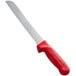 A Dexter-Russell bread knife with a red handle.