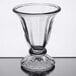 A Libbey clear tulip sundae glass on a table.