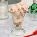 A Libbey glass cup with ice cream in it.