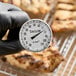 A Taylor 6235J 8-inch instant read probe dial thermometer displaying temperatures from -10 to 110 degrees Celsius.