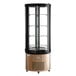 An Avantco copper circular glass refrigerated display case with glass shelves inside.