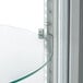 An Avantco refrigerated display case with glass shelves.