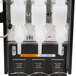 A Bunn hot beverage dispenser with three white plastic hoppers.