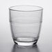 a clear glass with a curved rim