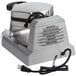 A silver Waring bubble waffle maker with a cord attached.