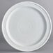 a white plate with a circular pattern