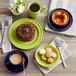 a table with plates of food and coffee