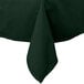 A hunter green rectangular tablecloth on a table.