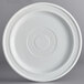 An Acopa Capri coconut white stoneware plate with a circular pattern on it.