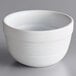 An Acopa Capri white stoneware bouillon bowl with a handle.