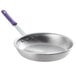 A Vollrath Wear-Ever aluminum frying pan with a purple allergen-free sleeve handle.