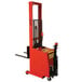 A red and black Wesco Industrial Products powered stacker with a small machine on it.
