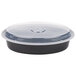 A black Pactiv plastic container with a clear lid.