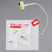 A yellow and white package for Zoll Adult CPR-Stat-Padz with a cable attached to it.