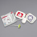 A white container of Zoll Adult CPR-Stat-Padz Electrode pads.