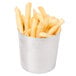 A close up of french fries in a stainless steel French fry cup.