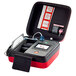 A red and black Philips Soft Case for a HeartStart FR3 AED holding a medical device.